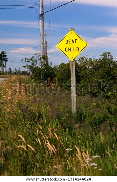 Yellow roadside caution sign for Deaf Child in\
Nova Scotia