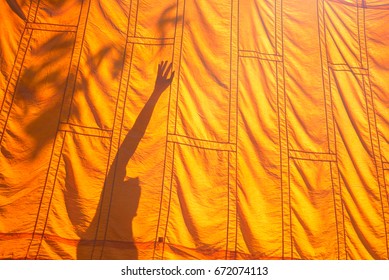 Yellow Robe And Shadow Of A Buddhist Monk Or Novice,Buddhist In Thailand