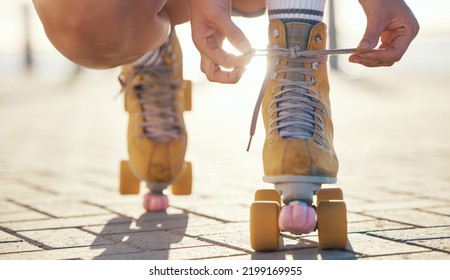 Yellow roller skates shoes of woman in summer outdoor travel, journey or fun activity for the holiday. Cool, trendy or funky gen z person prepare or tie laces on ground in quad skating with sunshine - Shutterstock ID 2199169955