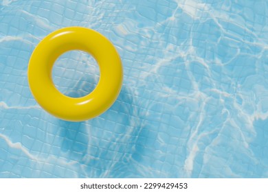 Yellow round donut pool float in a bright blue swimming pool for your summer project