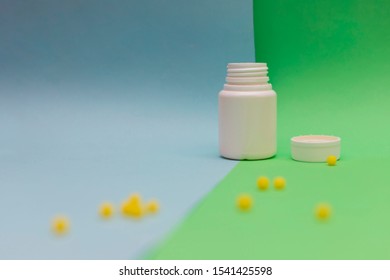 Yellow Round Jelly Beans Vitamins On Colored Background