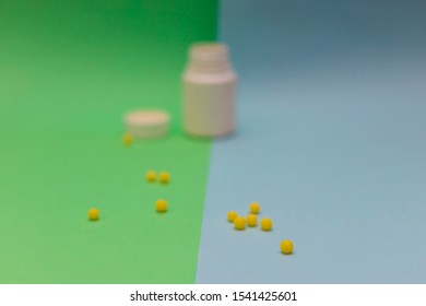 Yellow Round Jelly Beans Vitamins On Colored Background