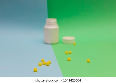 Yellow Round Jelly Beans Vitamins On Colored Background