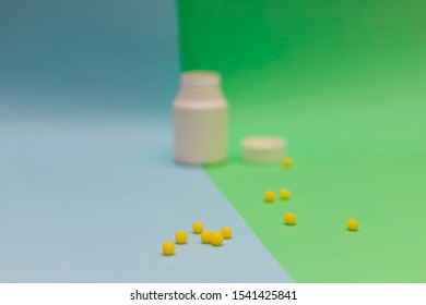 Yellow Round Jelly Beans Vitamins On Colored Background