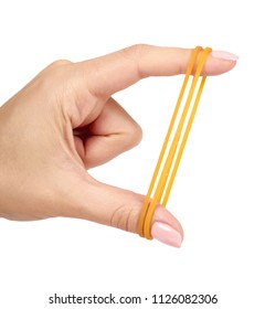 Yellow rubber bands close up with hand isolated on white background