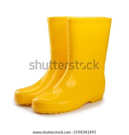 yellow rubber boots isolated on white background.