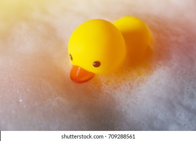 Yellow Rubber Duck Floated On The Bubble Water.