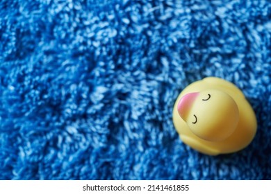 Yellow Rubber Duck On Blue Towel