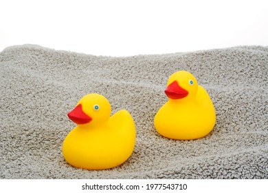 Yellow Rubber Ducky Toys On Towel