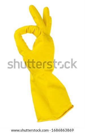 Yellow rubber gloves for cleaning, workhouse concept. Ok symbol. File contains clipping path.