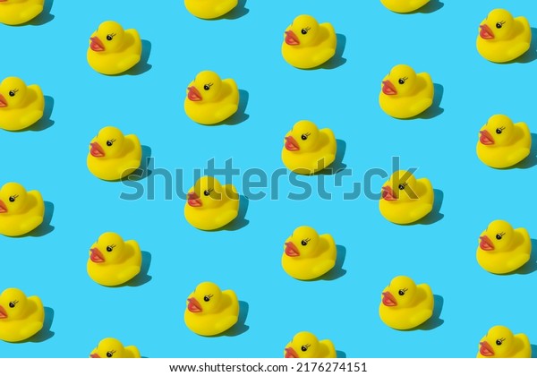 Yellow\
rubber toy duck on a blue background.\
Pattern.