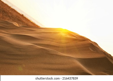 yellow sand on the sea beach and sunset sky closeup