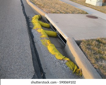 Yellow Sandbags Keeping Debris Out Of The Sewer System