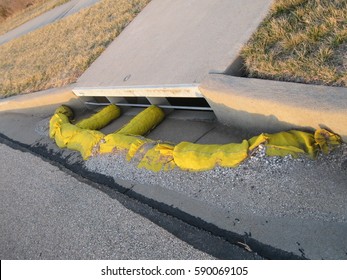 Yellow Sandbags Keeping Debris Out Of The Sewer System