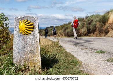 The yellow scallop shell signing the way to santiago de compostela on the st james pilgrimage route