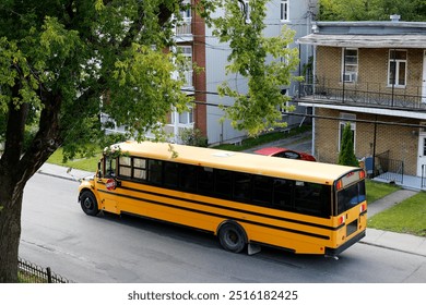 Yellow school bus on the street in the city. View from above. - Powered by Shutterstock