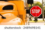 Yellow school bus. Stop sign. Be careful, schoolchildren crossing the road. New academic year semester. Welcome back to school. Lockdown, distance remote education learning