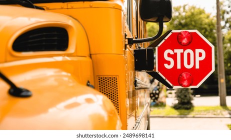 Yellow school bus. Stop sign. Be careful, schoolchildren crossing the road. New academic year semester. Welcome back to school. Lockdown, distance remote education learning - Powered by Shutterstock