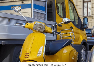 a yellow scooter parked next to a truck with a yellow cab - Powered by Shutterstock