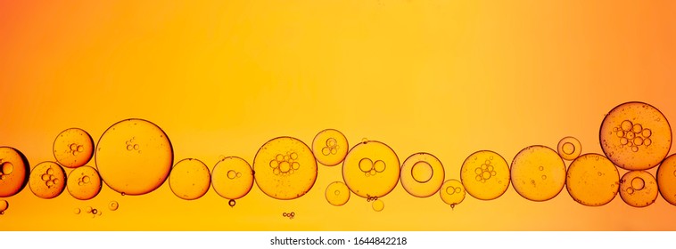 Yellow Serum Or Wash Gel Texture Background With Bobbles