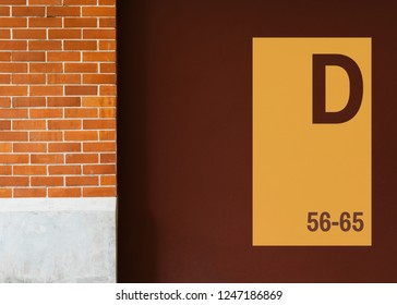 Yellow signboard mockup on a brown wall