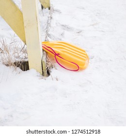 Yellow Sled Saucer Snow.