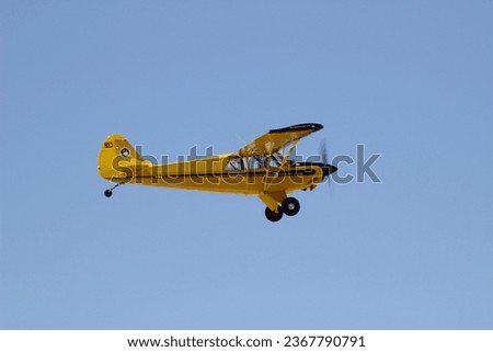A yellow small airplane view