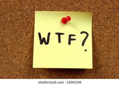 Yellow Small Sticky Note On An Office Cork Bulletin Board. Acronym Standing For What The F*ck?