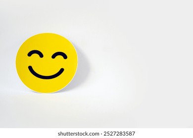 Yellow smiley face sticker. A smiling face is a symbol of happiness and positivity, conveying a sense of joy and optimism. - Powered by Shutterstock