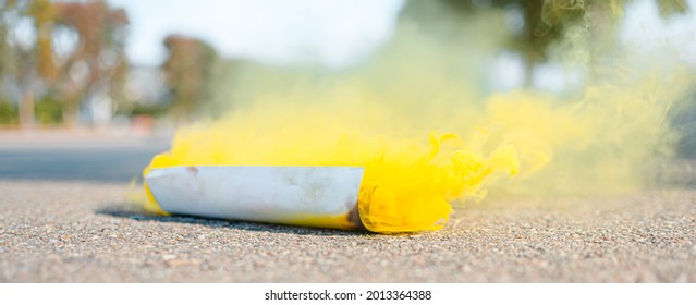 A Yellow Smoke Bomb On The Site. Banner