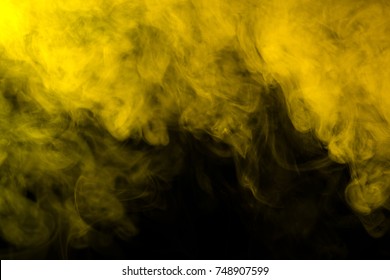 Yellow smoke on a black background