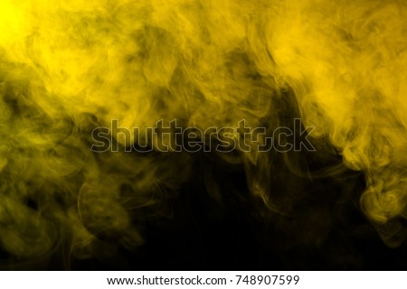 Yellow smoke on a black background