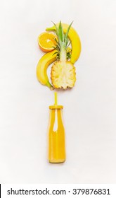 Yellow Smoothie Drink In Bottle With Straw  And Fruits  Ingredients ( Banana, Pineapple, Orange)  On White Wooden Background, Top View