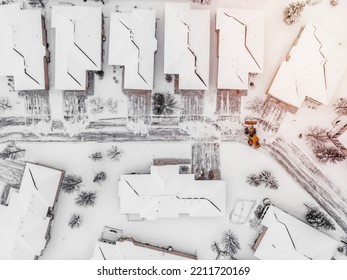 Yellow Snow Plow Clearing Suburban Streets