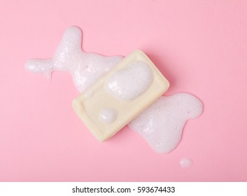 Yellow Soap Bar In Foam Isolated On Bright Pink Background, Top View