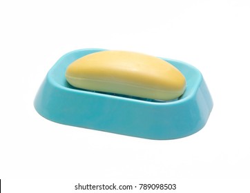 Yellow Soap On A Blue Soap Dish Isolated On A White Background