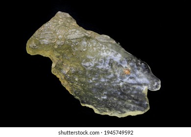 Yellow Specimen Of Libyan Desert Glass. Translucent To Transparent, Weighing 21.7 Grams. Surface Is Smooth, Mottled, With Evidence Of Flowing Motion. Photographed With Black Background In Natural Ligh