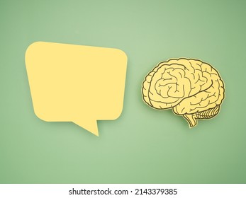 Yellow speech bubble and brain shape made from paper on a green background. Awareness of Alzheimer's, Parkinson's disease, dementia, stroke, seizure, or mental health. Neurology and Psychology care - Shutterstock ID 2143379385