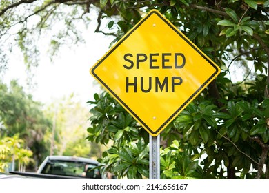 Yellow Speed Hump Ahead Warning Sign On Florida Neighborhood Street