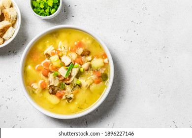 Yellow split pea soup puree with bacon. Space for text, top view.