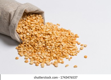 Yellow Split Peas On White In Studio