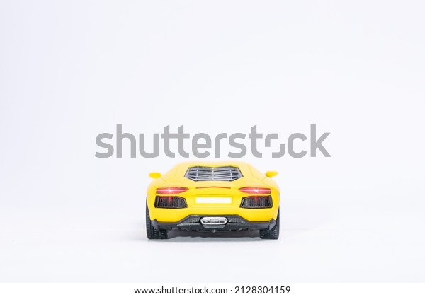 yellow sport car in white\
background