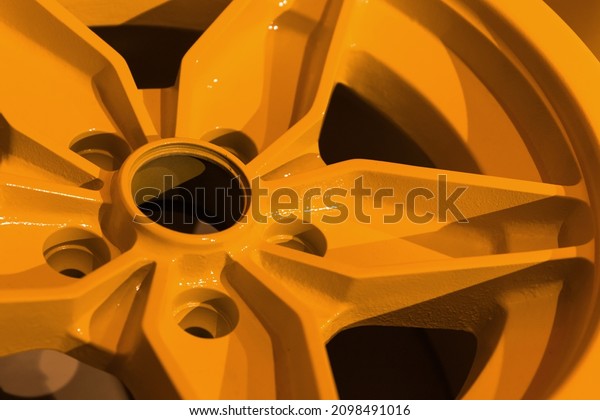Yellow sports car rim, close up photo. Abstract\
modern car design