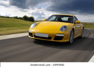 Yellow Sports Car At Speed