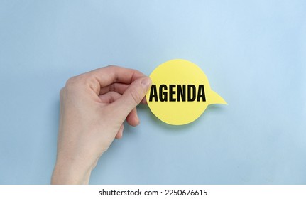 the yellow stacking of white business card with Agenda message on vibrant blue background. - Shutterstock ID 2250676615