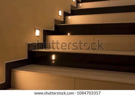 Yellow stairs up with illumination at night