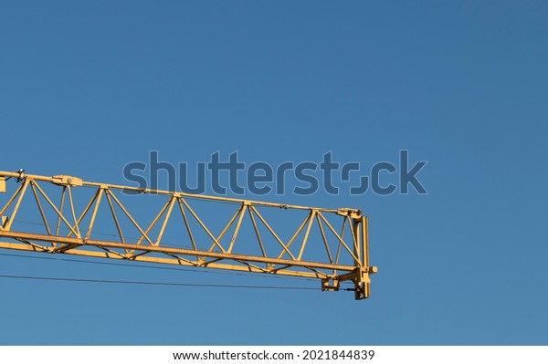 Yellow steel bars\
construction crane cantilever suitable for illustrating building\
and technological matter