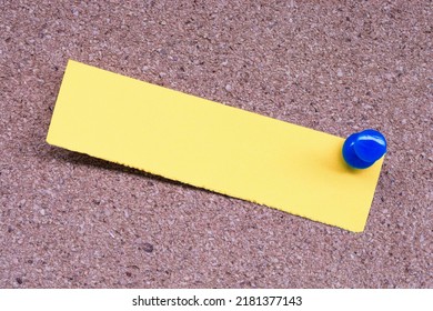 Yellow Stick Note And Blue Pinned To A Cork Notice Board. Copy Space. Reminder Concept.