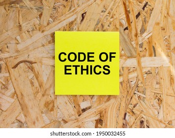 Yellow Sticker With Text Code Of Ethics On The Wooden Background. Concept Photo