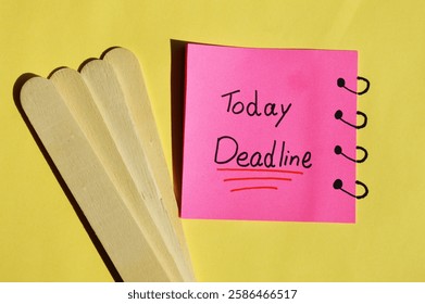 Yellow sticky note on date calendar with text written DEADLINE TODAY! concept of self warning to get job done ontime in very tight deadline to meet customers expectation